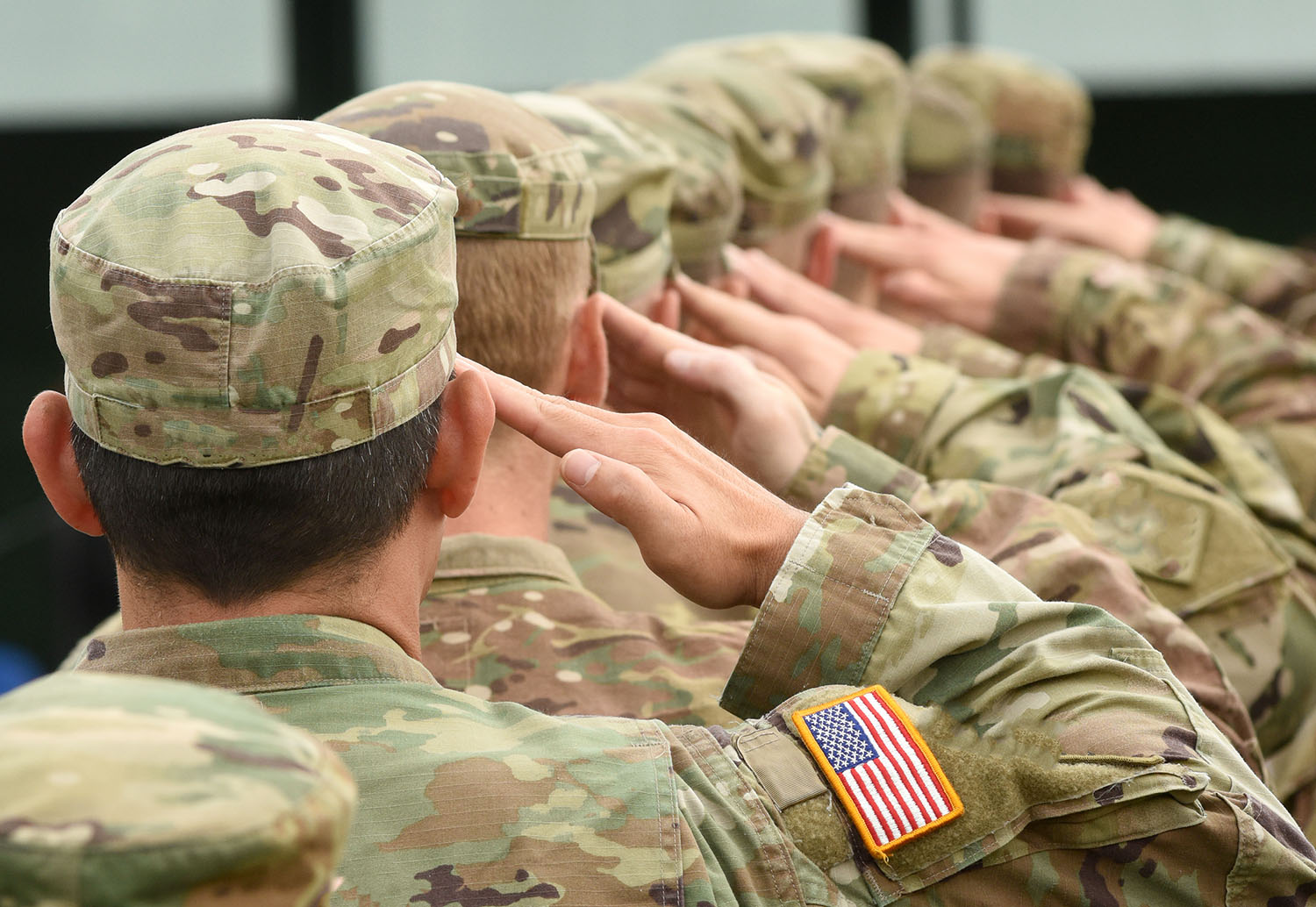 soldiers in uniform saluting