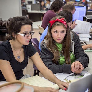 Creative writing students draft a shorty story.