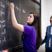 Student studies ancient language.