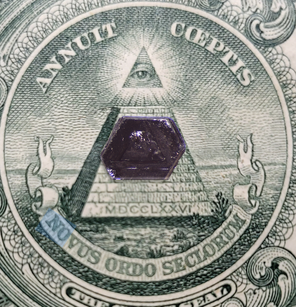 crystal on a dollar bill