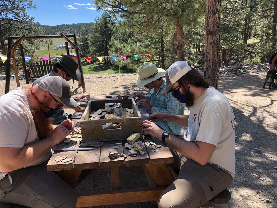 Students examining minerals at field camp.