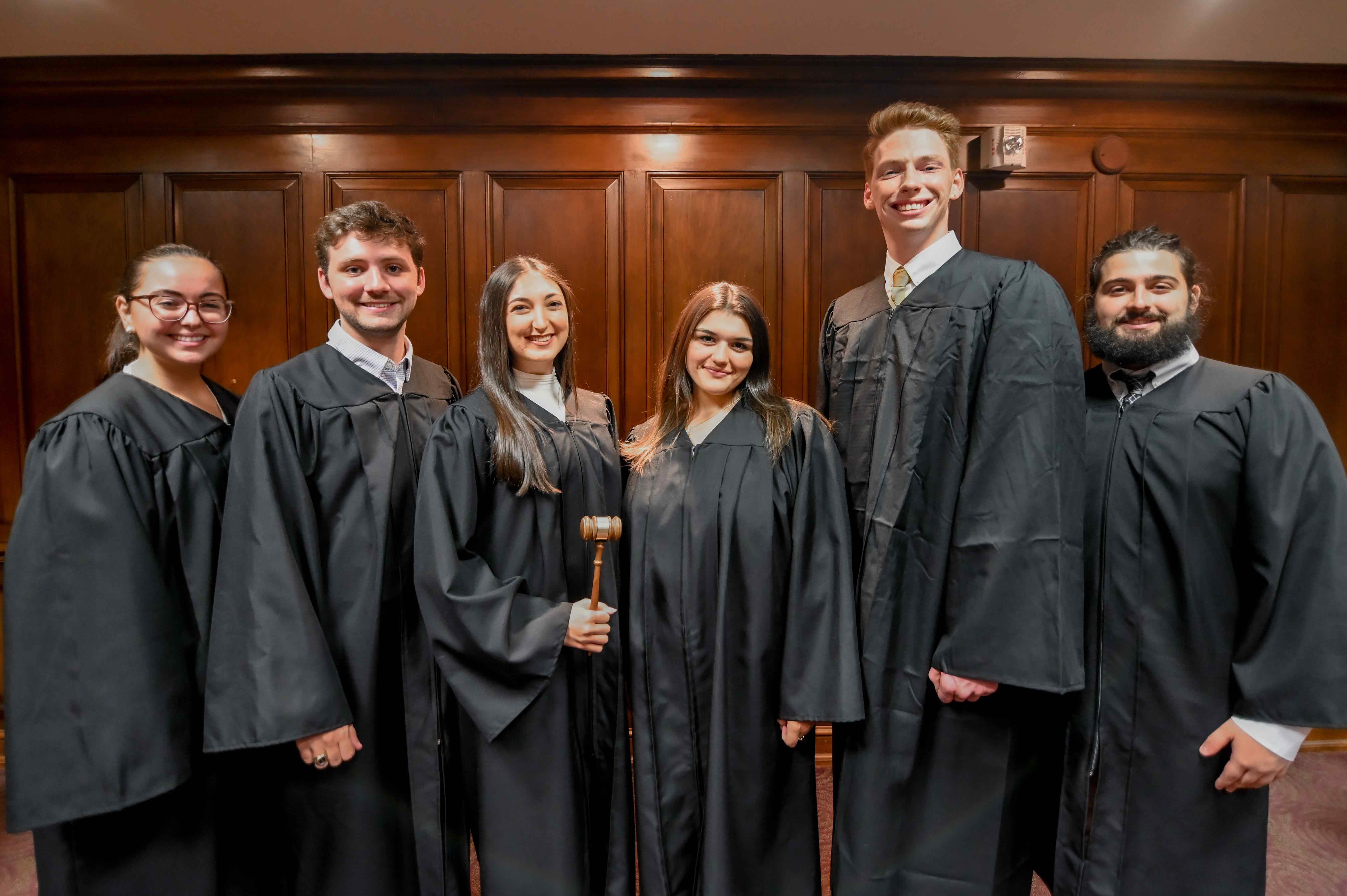 justices standing in robes