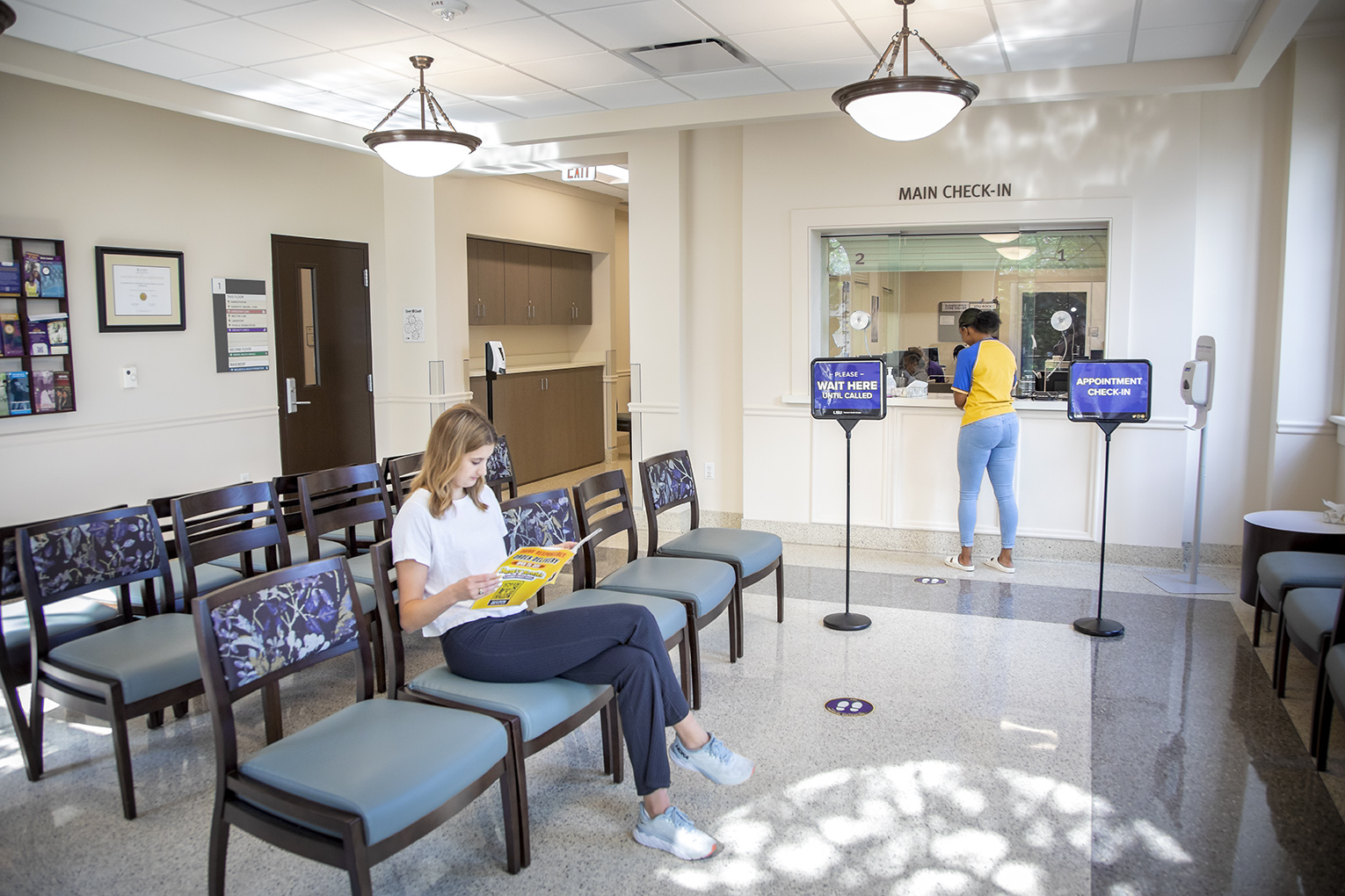 student checking in at student health center