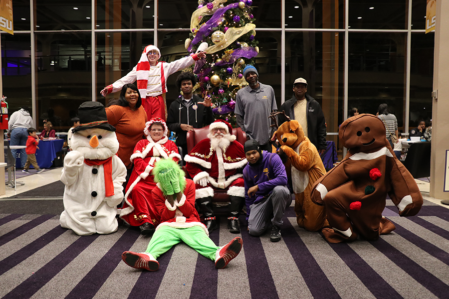 staff with Santa and Mrs. Claus