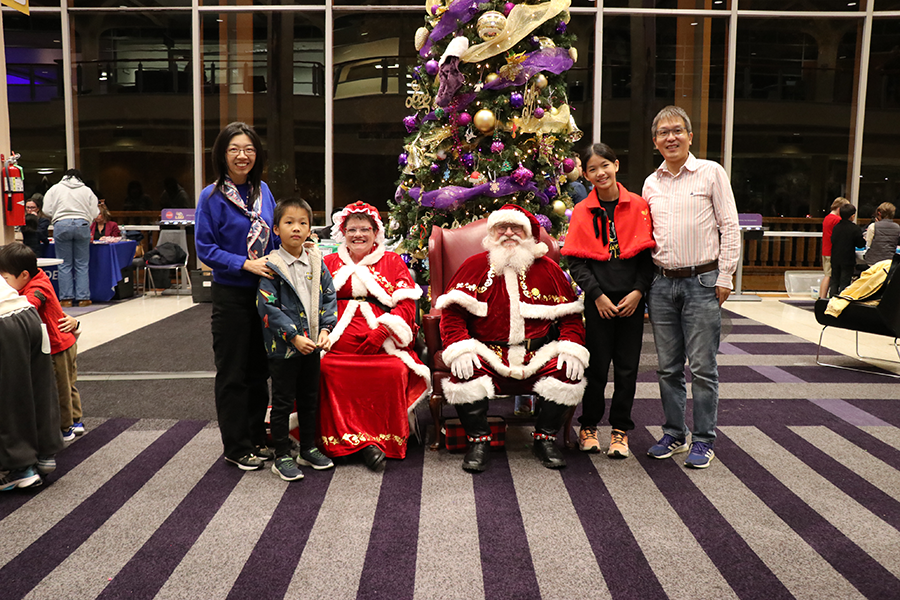family with Santa and Mrs. Claus